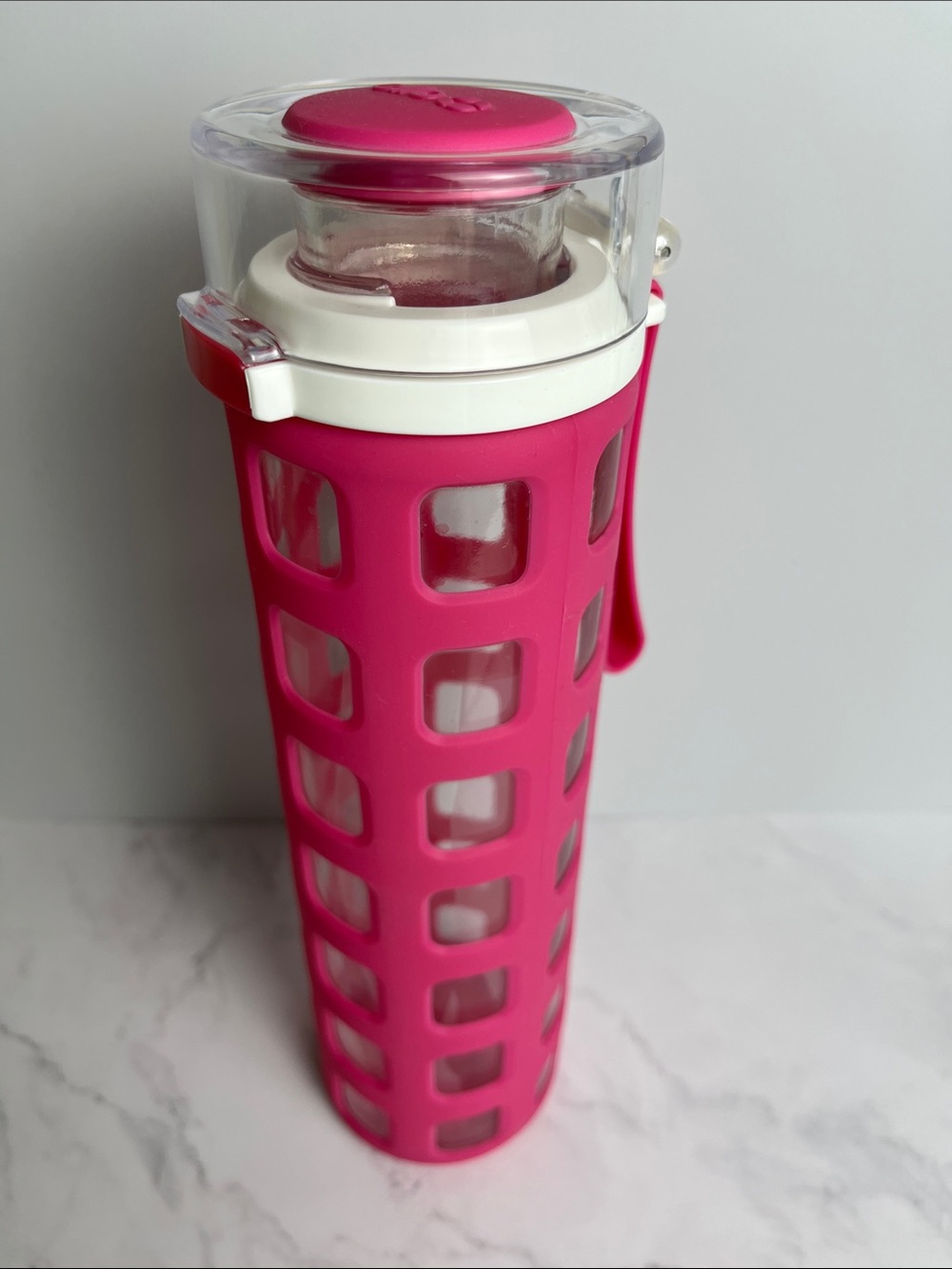 20 oz Glass Water Bottle with Hot Pink Silicone Sleeve and White Flip Lid